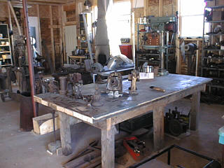Large workbench with drill press, shear etc.